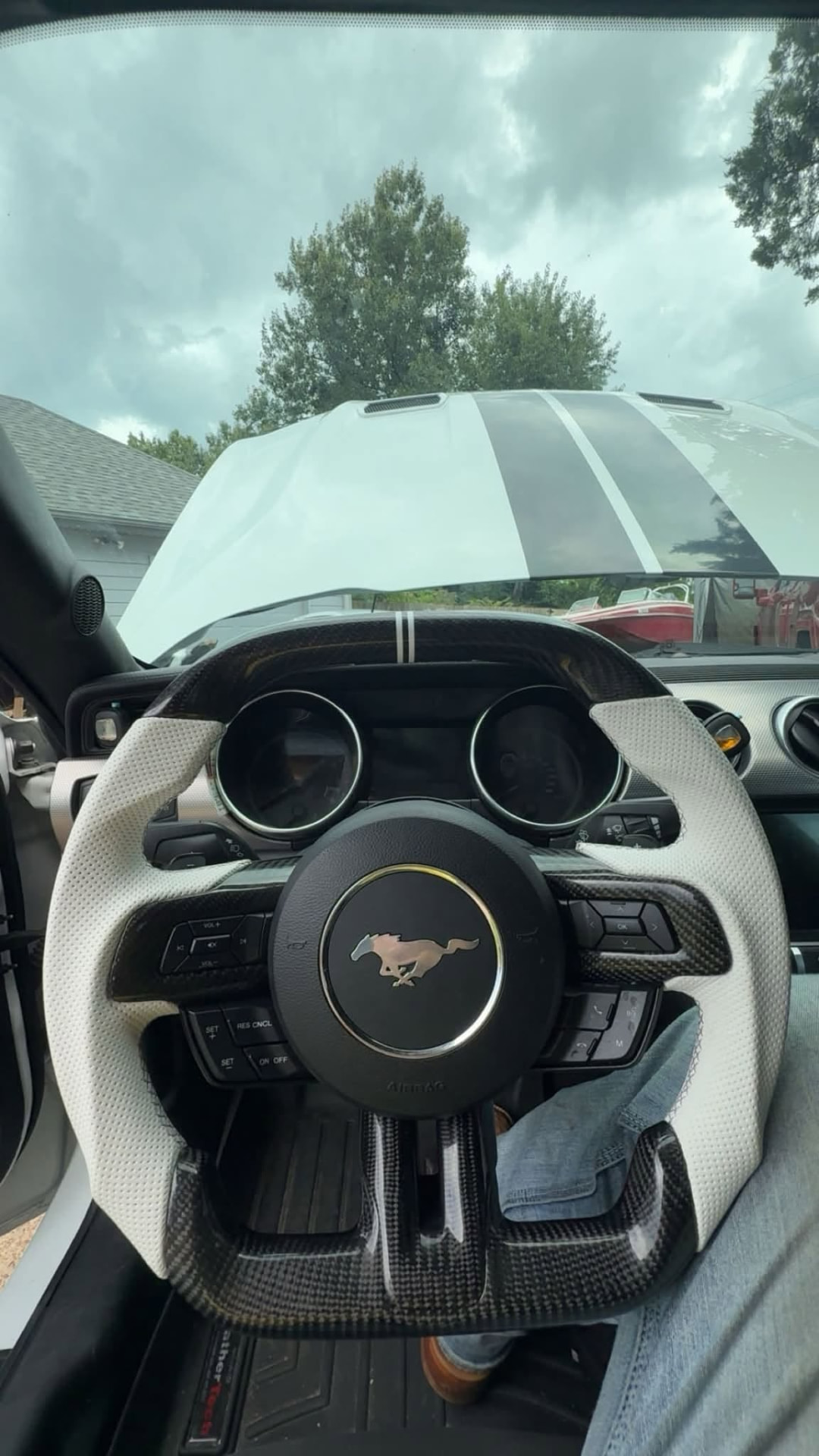 Interior of a Mustang with a custom carbon fiber steering wheel installed by the Smiths mechanic shop